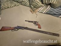 Umberti Winchester und Colt