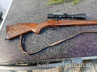 Repetierbüchse Mauser 8x57 mit schönem geschnitzten Jagdmotiv Nussbaumschaft